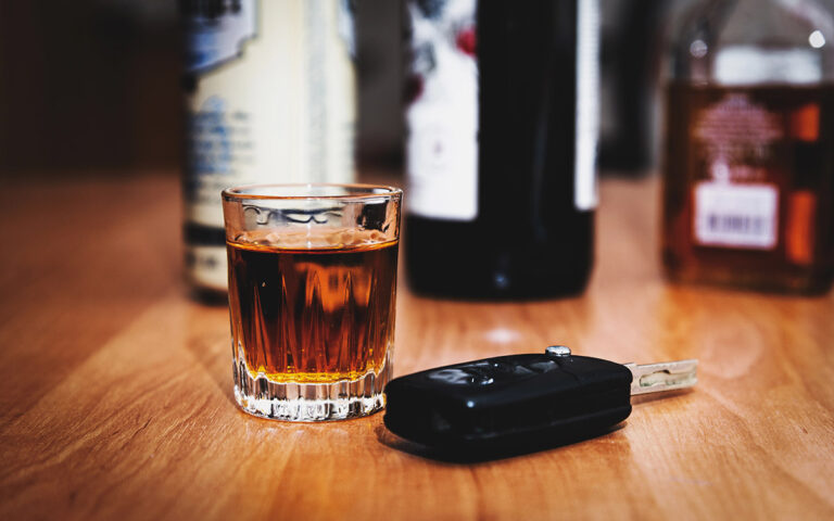 DWAI vs. DWI in New York: Why the .07 BAC Line Changes Everything A glass of whiskey and car keys on the table.Drunk driving